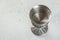 Vintage pewter goblet on concrete background