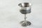 Vintage pewter goblet on concrete background