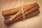 Vintage photo, Cinnamon sticks on wooden table, seasoning for cooking