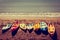 Vintage photo of colourful kayaks lined up on a sandy beach. Toned image