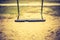 Vintage photo of empty swing on children playground