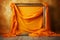 Vintage photo frame with orange drapery of silk satin linen cloth fabric textile on wooden floor