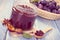 Vintage photo, Fresh plum marmalade in jar, spices and ripe fruits in wicker basket, healthy sweet dessert