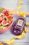 Vintage photo, Fruit and vegetable salad and glucometer with tape measure, concept of diabetes, slimming and healthy nutrition