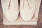 Vintage photo, Leather shoes and stack of clothing for woman on rustic boards