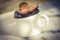 Vintage photo, Plums in metallic mug on wooden table in garden on sunny day