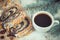 Vintage photo, Poppy seeds cake, cup of coffee and spruce branches, dessert for Christmas time