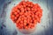 Vintage photo, Red autumnal rowan on rustic wooden background