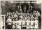 Vintage photo shows children and pastor in the church. Antique black white photo.