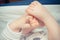 Vintage photo, Tiny hand and foots of newborn baby