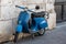 Vintage Piaggio Vespa 50 parked in the street