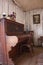 Vintage piano in old wooden cottage