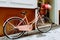 Vintage Pink Bicycle With A Decorative Basket Of Flowers Parking