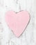 Vintage pink heart on a wooden background