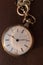 Vintage pocket watch in sunlight. Retro clock. Antique jewelry. Time background.