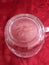 Vintage Pressed Glass Clear Crystal Cream Pitcher Details on red Background