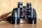Vintage prism black color binoculars and brown leather case