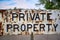 Vintage private property sign. Metallic and rusty. Close up