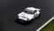 Vintage racing car, classic retro motor sport action, Porsche 911 RSR on asphalt race track