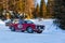 Vintage racing cars driving classic rally on snow covert road