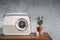 Vintage radio with cactus on the wooden table