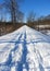 Vintage railroad track repurposed hiking path in winter