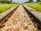 Vintage railway with ballast and rail sleepers in countryside, T
