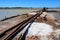 Vintage railway. Old rails at a salt factory. Sea salt. Blue sky. The photo