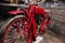 Vintage rare red motorcycle standing at vehicle exhibition