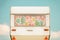 Vintage rear of a caravan with seventies flower curtains