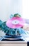 Vintage record player pink vinyl record hand tropical leaves old turntable