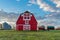 Vintage red barn in prairie farmyard in Saskatchewan