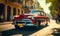 Vintage red classic car cruising on a sunny street in Havana with historical architecture and tropical vibes, capturing the