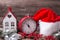 Vintage red clock, Santa hat , decorative house, branches fur