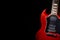 Vintage red electric guitar on moody dark background