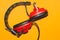 Vintage red headphones on yellow background. classic earphones