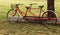 Vintage red tandem bicycle with basket