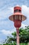 Vintage, retro, ancient lamppost at the park colored red