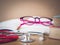 Vintage retro of books, a stethoscope glasses and pencil on a wooden desk