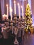 Vintage retro brass candlesticks with candles burning, luxury event banquet table setting decoration in a restaurant hall,