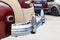 Vintage retro car rear chrome bumper with taillamp in beige and brown color, handmade with wood and chrome for restoration. Auto