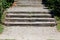 Vintage retro improvised steps made from dilapidated old cracked wooden boards filled with small grain gravel in public park