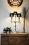 Vintage retro lamp, sculpture and decorating items on wood cabinet
