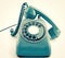 Vintage retro phone in cyan blue