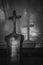 Vintage, retro photo of a cross on an old headstone and its shadow in the Old Southern Cemetery Alter SÃ¼dfriedhof of Munich.
