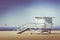 Vintage retro picture of wooden lifeguard tower, Beach in Califo