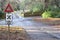 Vintage retro road sign post cross roads in countryside