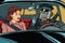 Vintage retro robot autopilot car, woman passenger