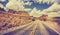 Vintage retro stylized scenic desert road.