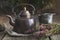 Vintage retro teapot, cup of healthy herbal tea, heather bunch.